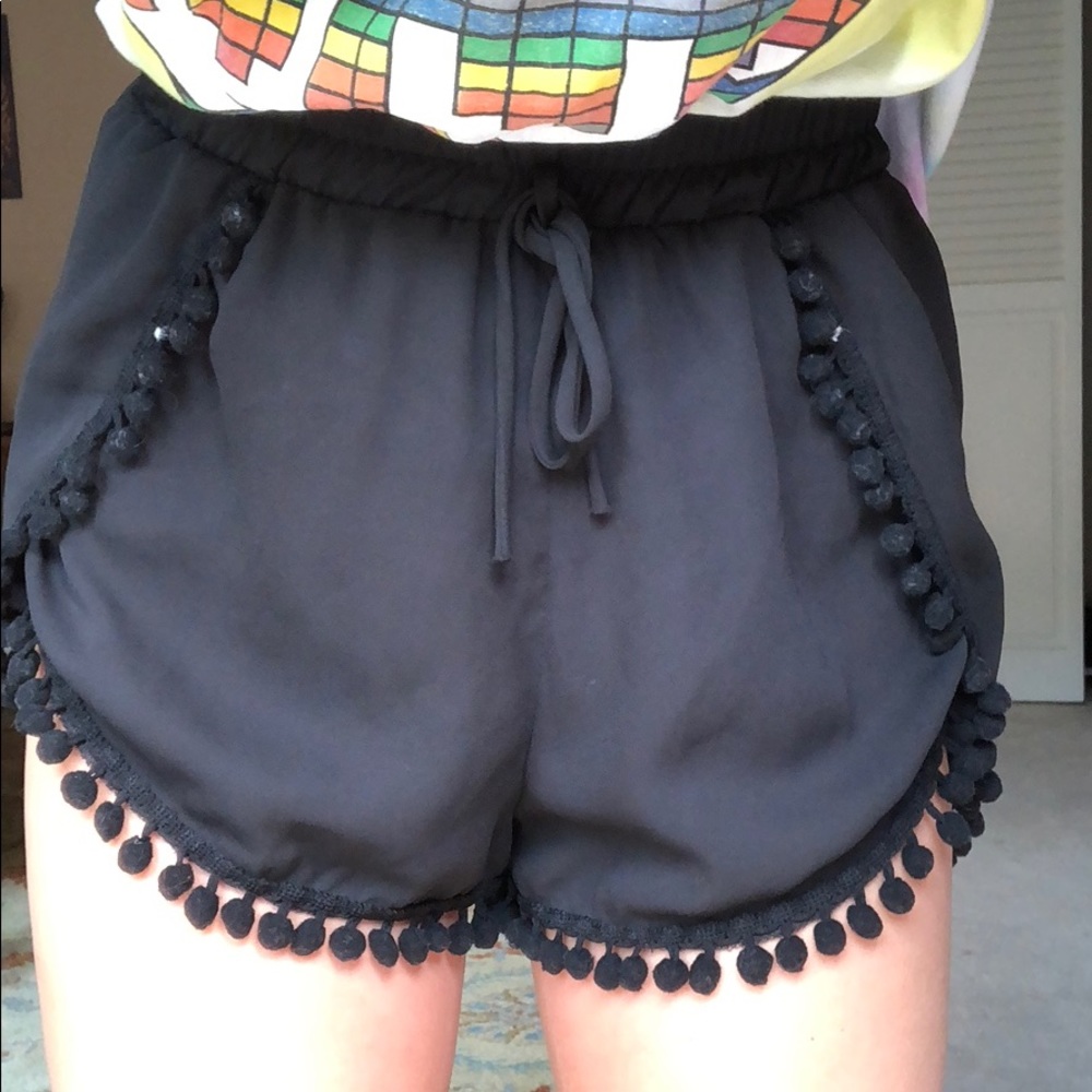 black pompom shorts